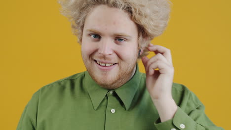 man with curly hair expressing different emotions
