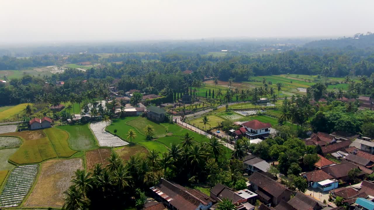 Sriwedari village and rice fields, Muntilan in Indonesia. Aerial forward