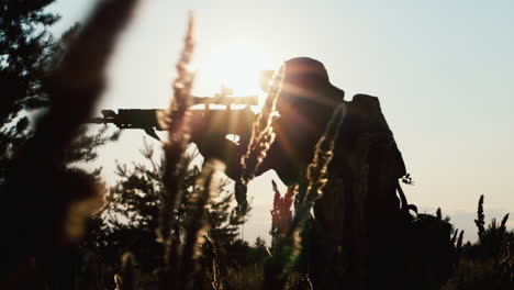 silhouette of a sniper aiming with a rifle