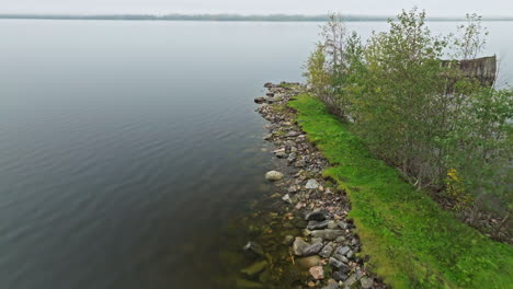 seawall at the calm lake on a cloudy day in sweden