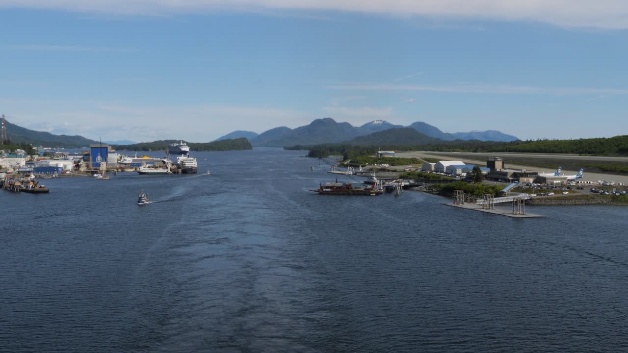 Tongass Narrows, sailing out from Ketchikan, Alaska.City of Ketchikan on the left side of the channel an Ketchikan Airport on the right side of the channel.