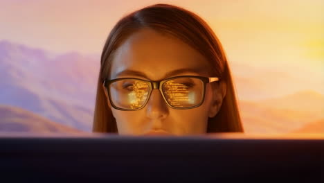 woman coding with digital reflections in glasses