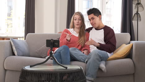 young bloggers creating content for social media while making a video at home.