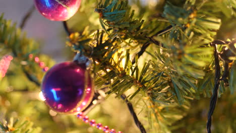 christmas tree with colored balls and bokeh