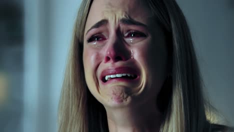 in a poignant late-night scene unfolding in her home, a woman displays a deeply emotional reaction, her tears revealing her distress
