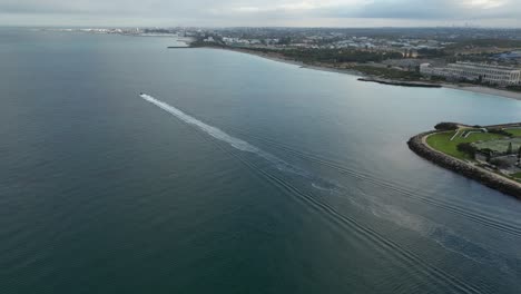 small ship departing coogee port in perth city, western australia
