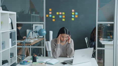 woman working in modern open office space
