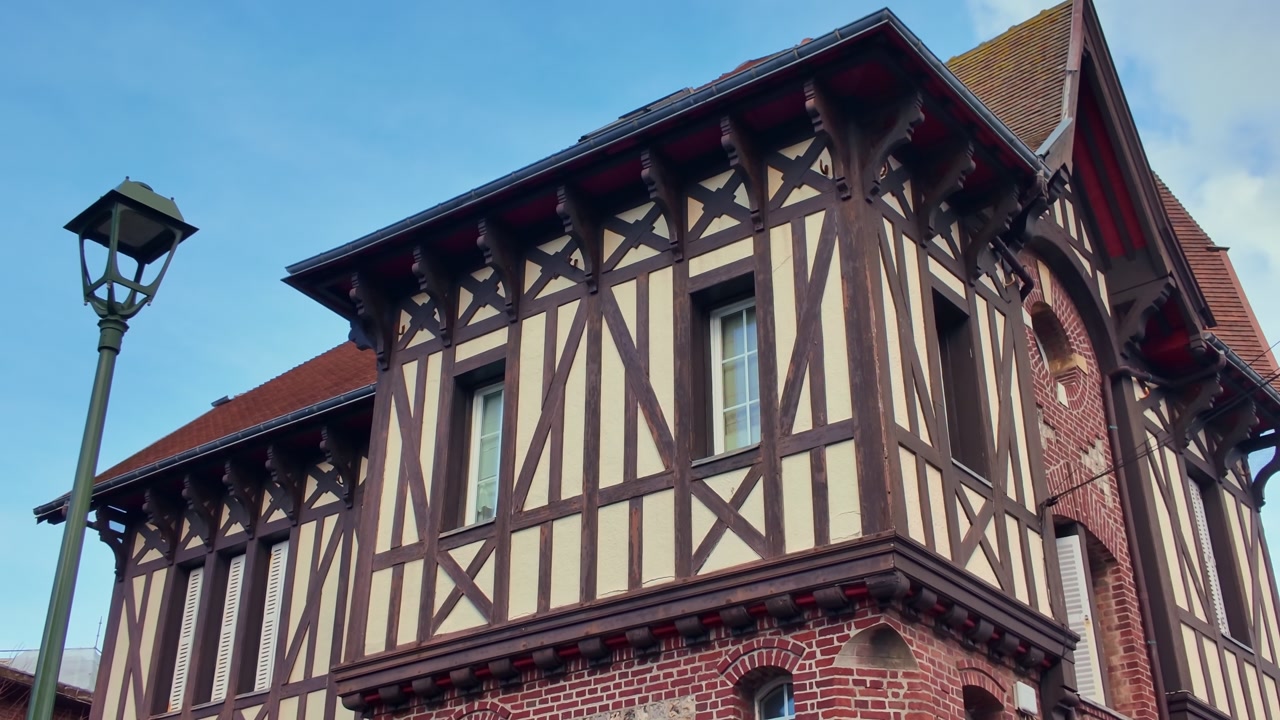 Low angle view of a beautiful traditional half-timbered house in Etretat, Normandy, France