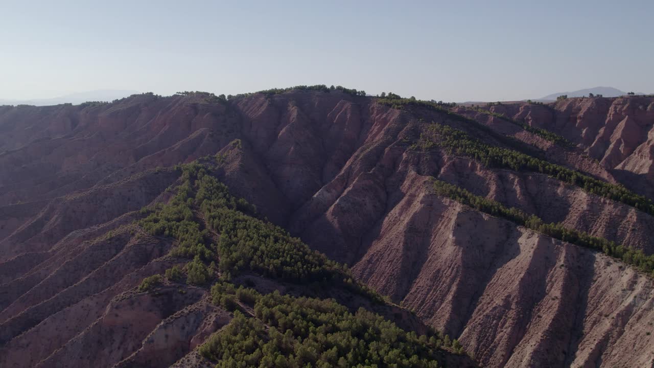 Badlands. Aerial view. Ravines. Carcavas. Erosion, Gullies. Desertification.Climate change. Gorafe desert. Spain