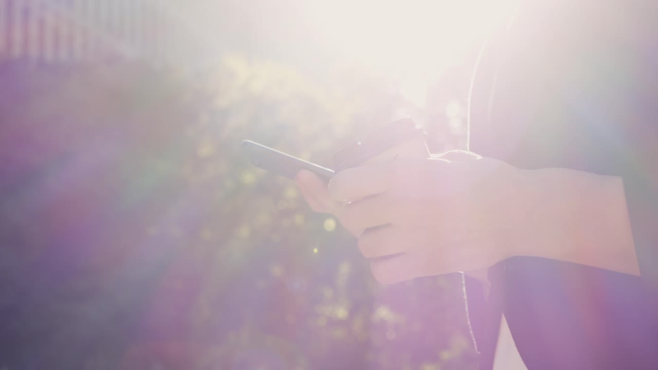 Person holding a smartphone and coffee cup