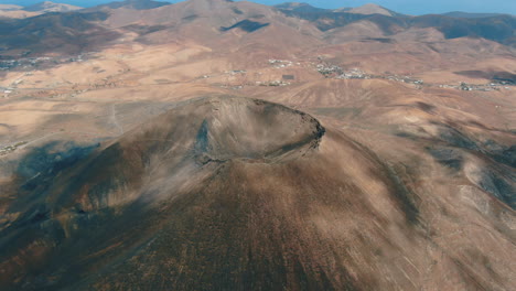 gairia volcanic caldera: aerial view traveling in over the caldera on a sunny day and on the island of fuerteventura