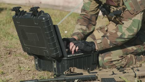 military surveillance officer with laptop