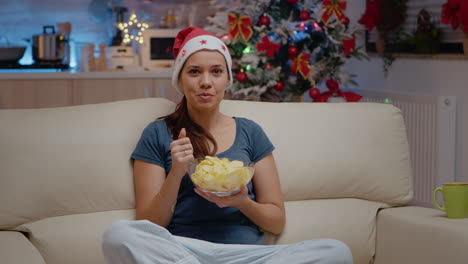 pov of woman using video call communication and eating chips