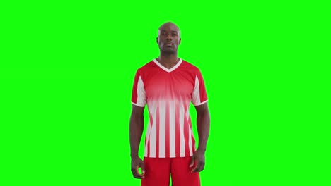 video of african american male soccer player on green screen background