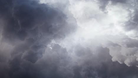 pov of dark and light clouds in the dark sky