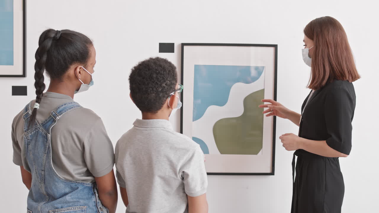 Woman Presenting Painting to Little Visitors