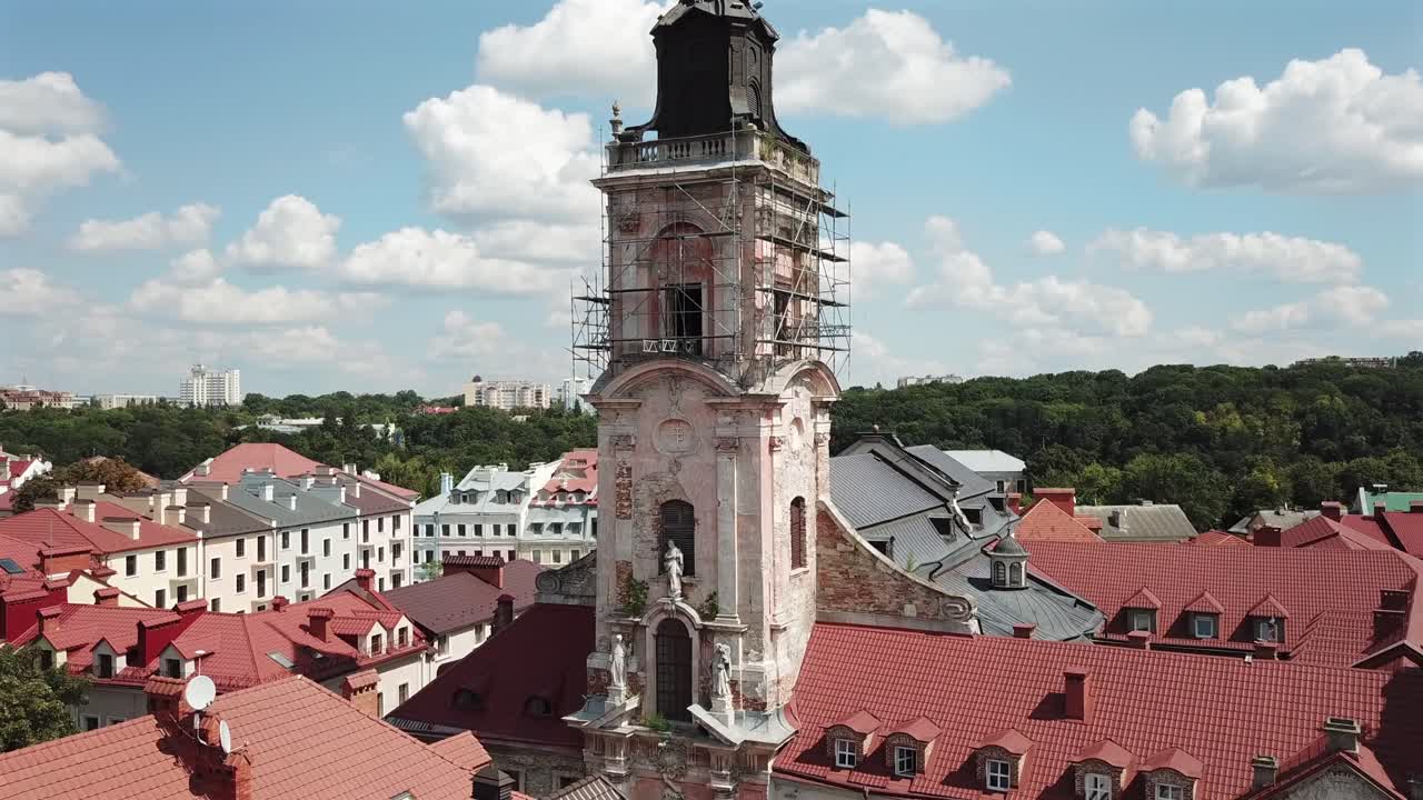 Aerial View of Dominican Monastery's Tower at Kamyanets Podilsky,Ukraine on a sunny day with white clouds.Pan right.