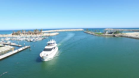 Aerial-drone-shot-of-a-Yacht-arriving-to-the-Marina-of-San-Jose-del-Cabo,-Baja-California-Sur