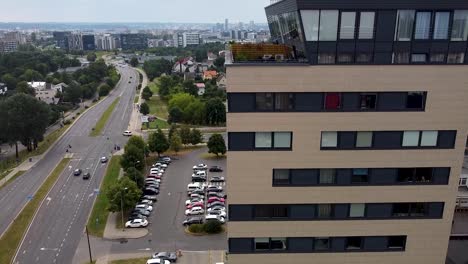 cinematic rise next to high rise building and opening shot of a city scape