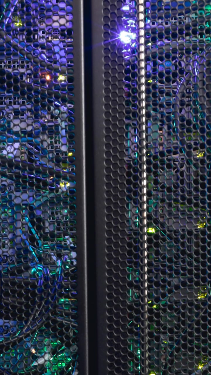 Video of close up of purple and green lights in computer server