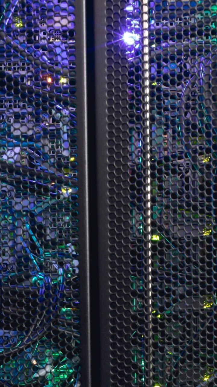 Video of close up of purple and green lights in computer server