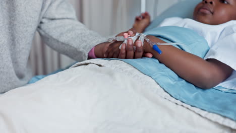 Hospital,-bed-and-parent-holding-hands-with-child