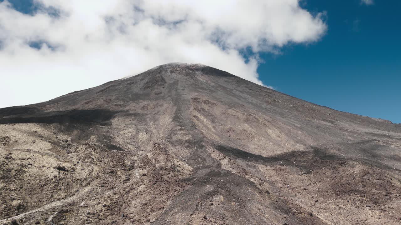 Volcanic Mountain Peak with Clouds