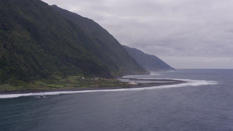 coastal rural village, a lagoon, with lush green cliffs landscape, fajã£ de santo cristo, sã£o jorge island, the azores, portugal