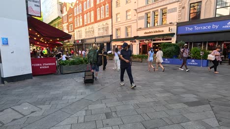 people walking near shops and restaurants