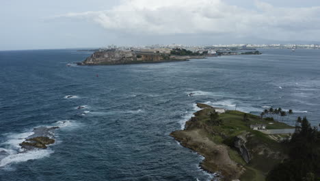 aerial view over the rugged coastline of isla de cabra in puerto rico