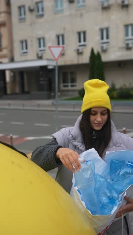 woman recycling plastic bottles