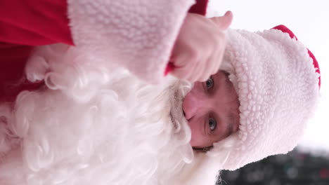 santa claus with a real beard and a big smile with a thumbs up santa claus with a real beard and a big smile with a thumbs up close up