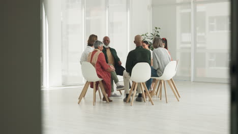 Business-people,-talking-or-counselling-in-circle