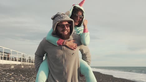 couple in animal costumes on the beach