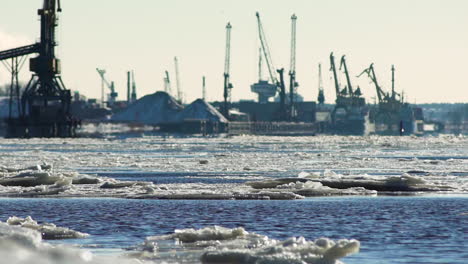 frozen maritime port on sunny morning, long shot