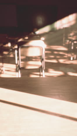 empty classroom with sunlight streaming through the windows