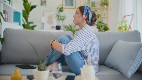 Sad,-Lonely-Woman-Sitting-Alone-on-Sofa-at-Home