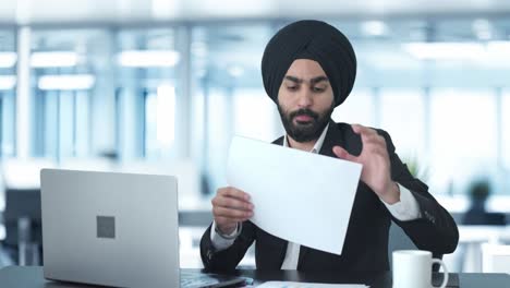 sikh indian businessman working on laptop