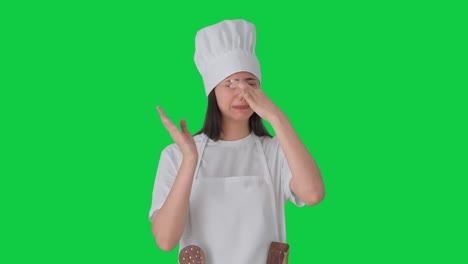 upset indian female professional chef disturbed by bad smell green screen