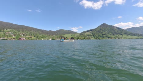 schliersee lake in bavaria munich this beautiful lake was recored using dji osmo action in 4k summer 2020 following boat from side view