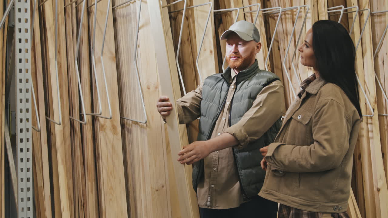 Couple Looking at Siding Panels at Store