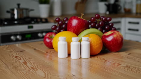 healthy food and supplements on a kitchen table