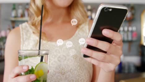 animation of message icons floating over mid section of caucasian woman using smartphone at a bar