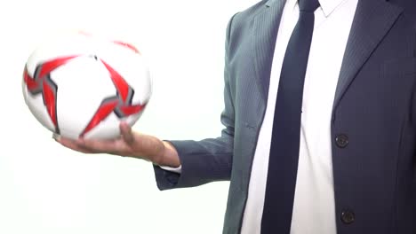 businessman throw soccer or football on white background close up