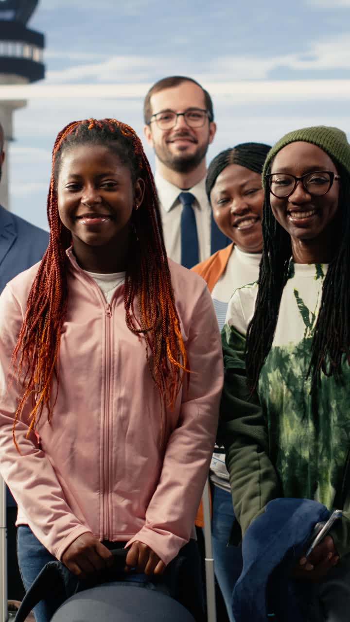 Diverse Group of Happy Travelers Smiling at Airport Terminal