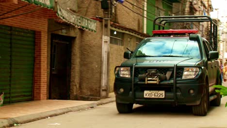 police vehicle patrolling the favela for drug gangs