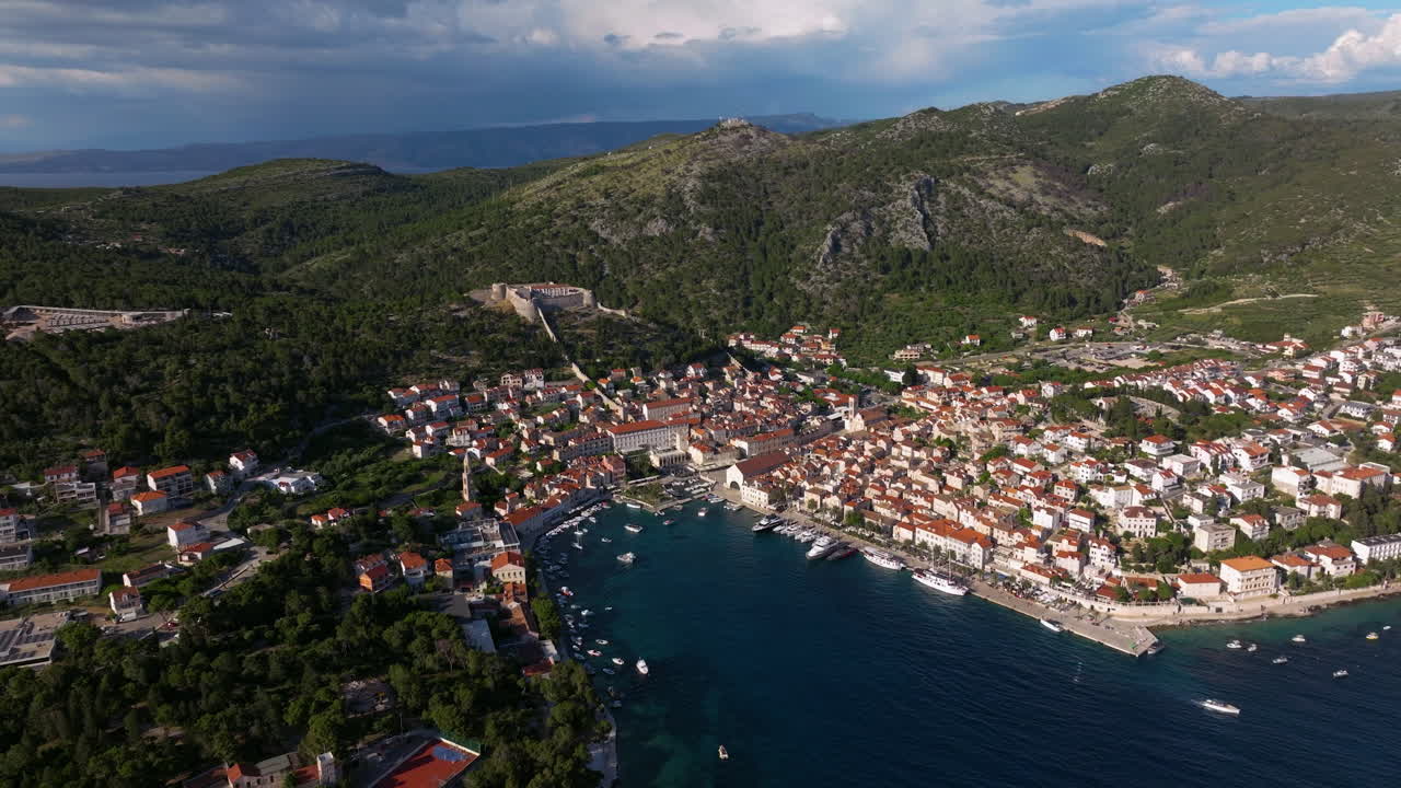 Hvar Town Houses And Spanish Fortress In Split-Dalmatia County, Croatia. - aerial shot