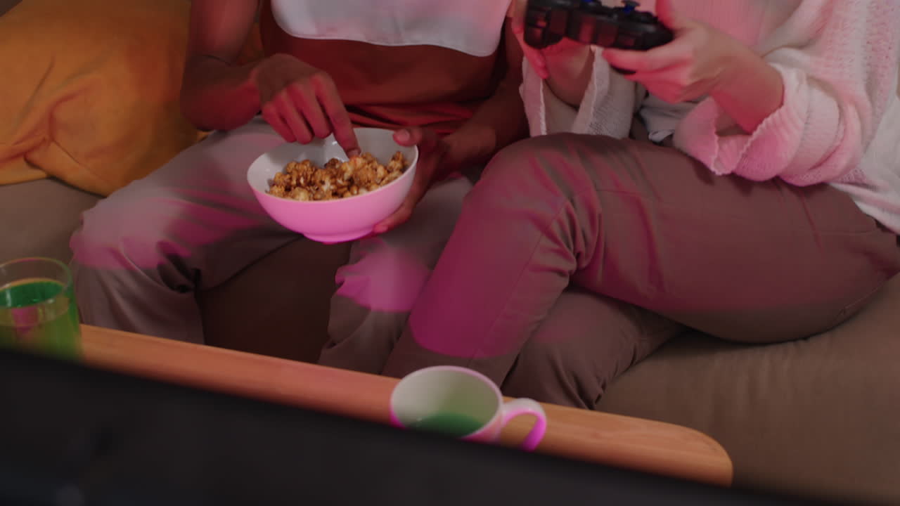 Intercultural Couple Playing Video Games at Home