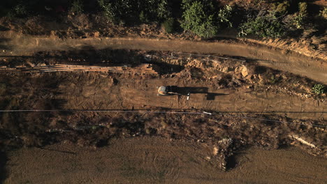 aerial top down view of an excavator