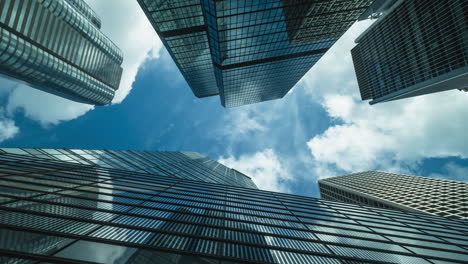 Time-lapse-of-skyline-commercial-buildings-and-cloud-sky